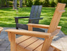 Aria Adirondack Chairs Natural Teak and Black on Stone Patio