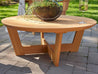 Natural Teak Cannon Beach Conversation Table with wine glass on stone patio