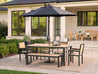 Natural Teak Park City Dining Table with umbrella on patio