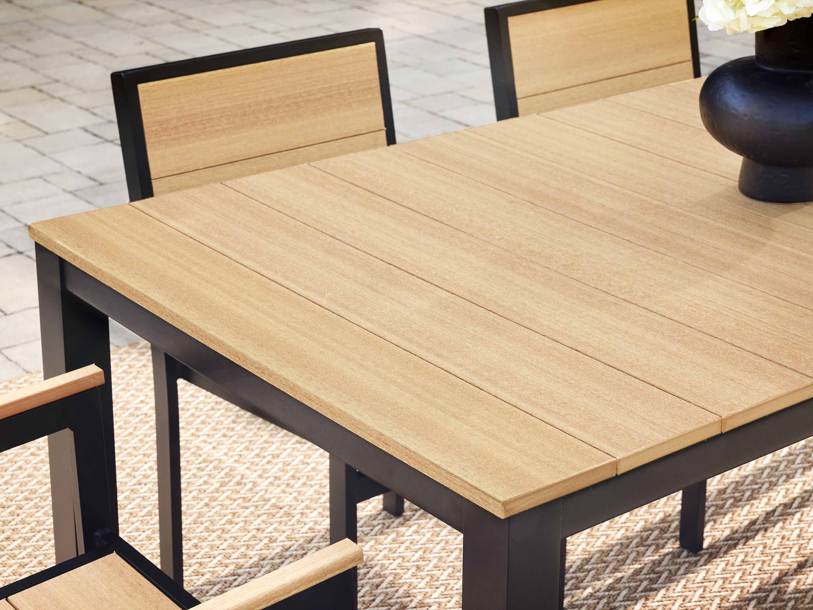 Park City Dining Table with black frame and natural teak Close up