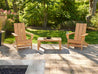 Two Aria Adirondack Chairs with Modern Coffee Table on a stone patio