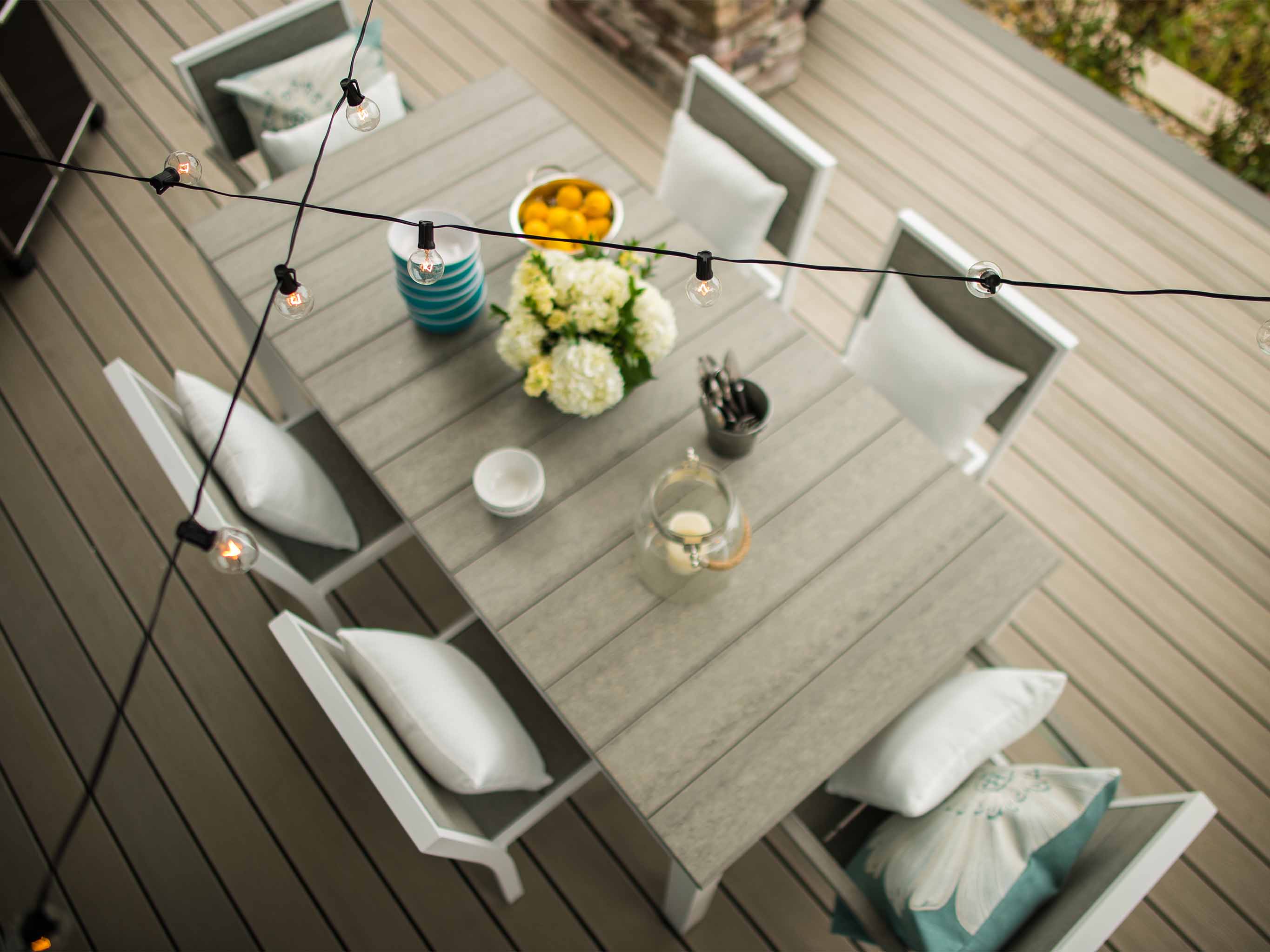 Park City Dining Set with Coastal Gray White Frame with pillows and lights