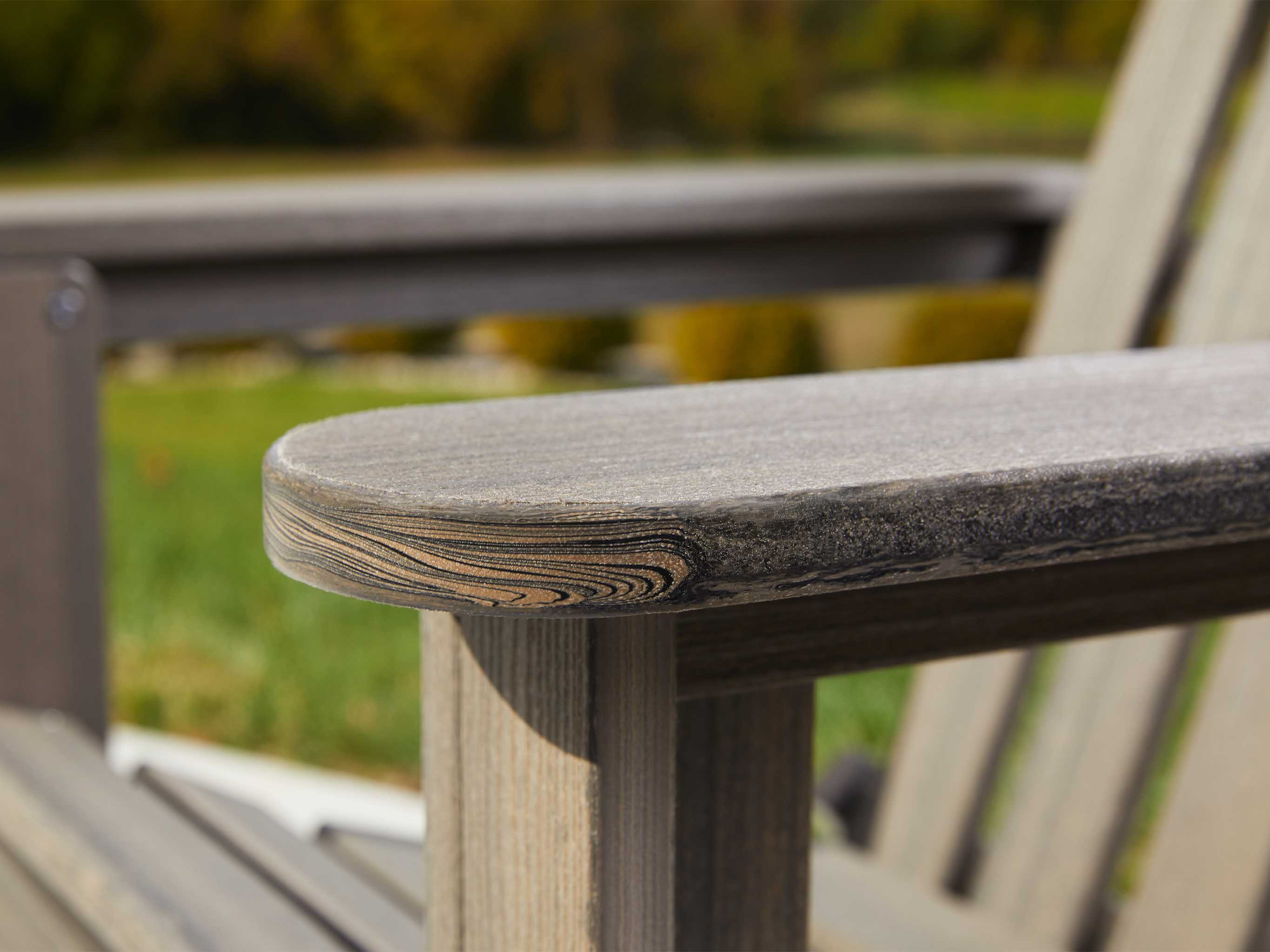 Close up on arm of a chair made with Coastal Gray Tangentwood