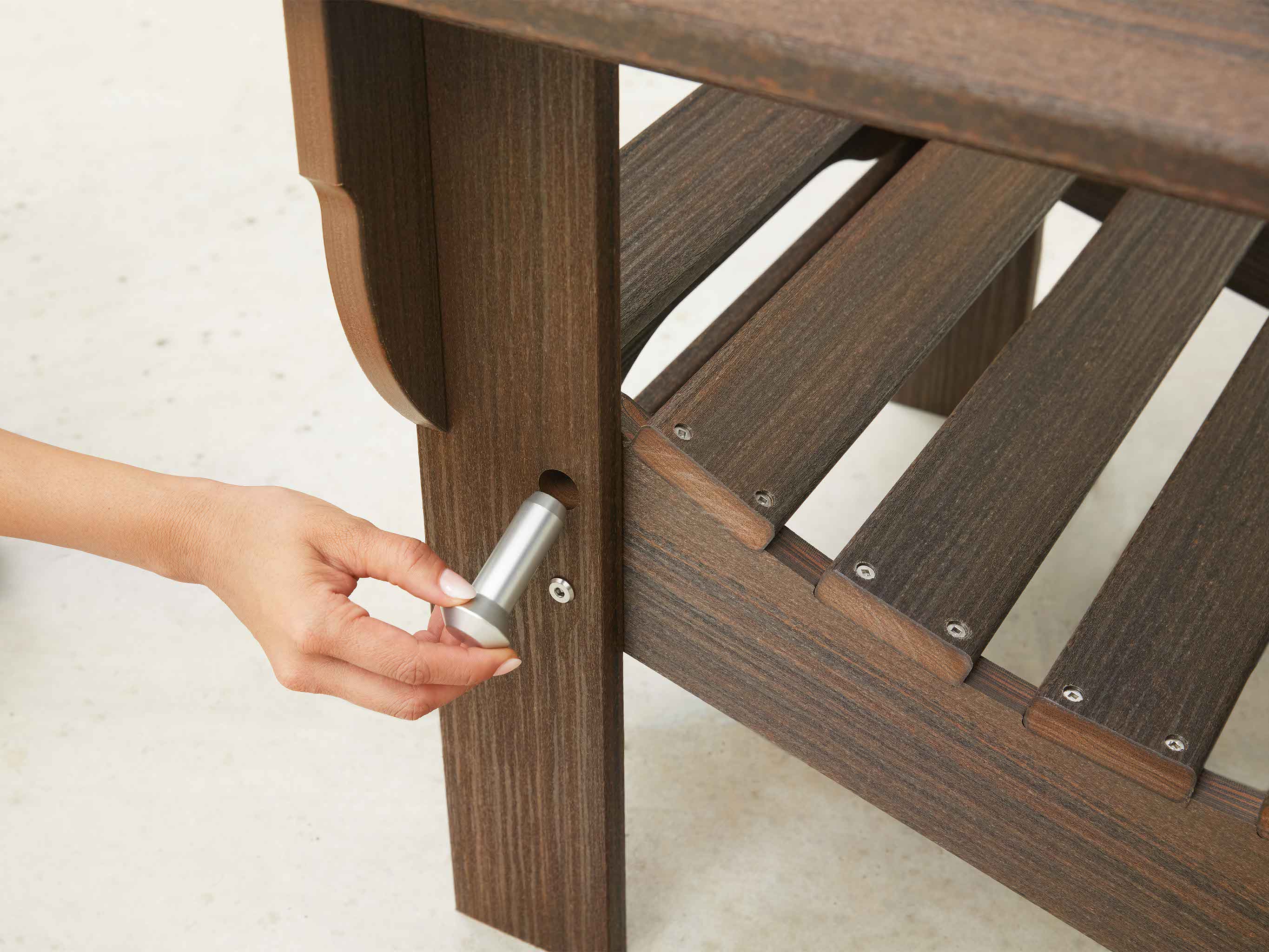 Folding Adirondack Chair Closeup on Pin being inserted