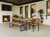Park City Dining Set with Natural Teak woodgrain and black frame fireplace patio