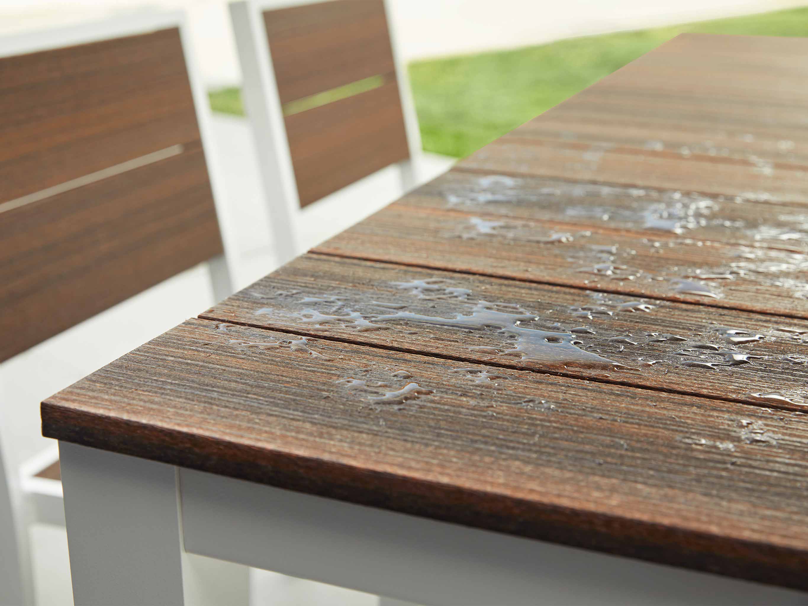 Park City Dining Table with White Frame and Woodgrain with Water on Surface